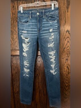 American Eagle Outfitters Distress Blue super super stretch jeggings size 8